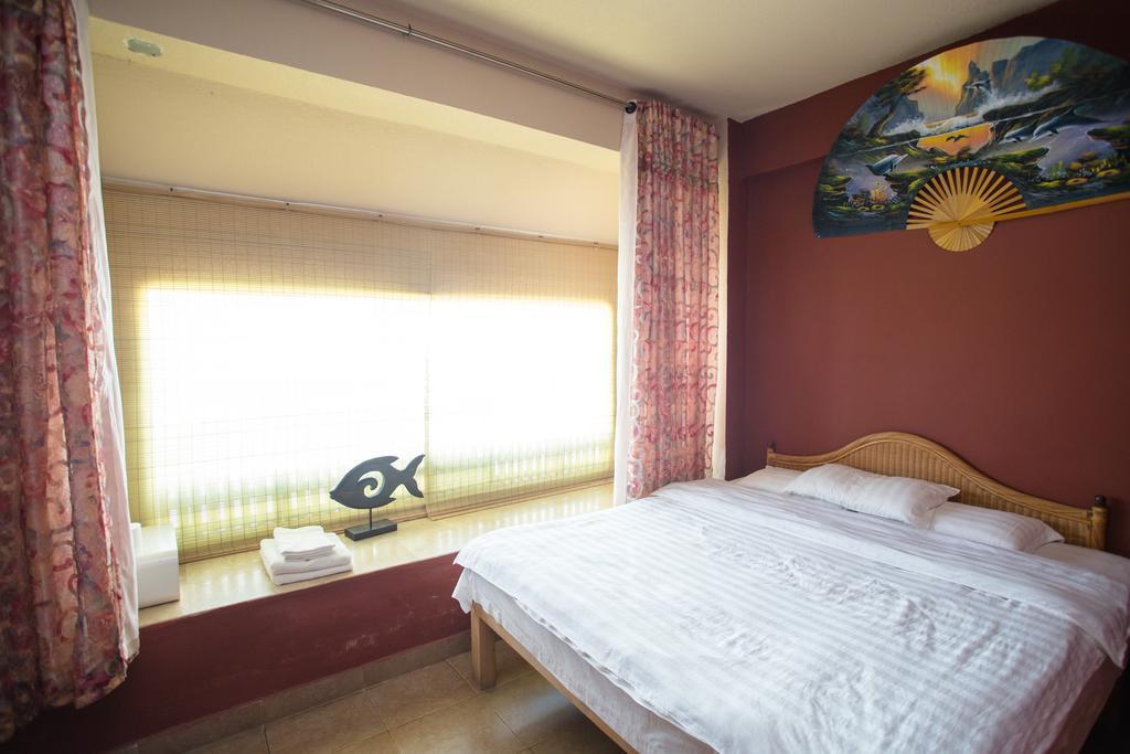 G.T. Guest House Garapan Quarto foto