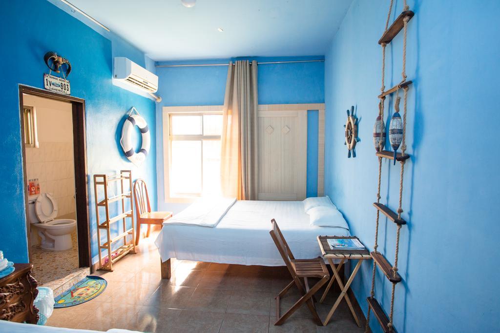 G.T. Guest House Garapan Quarto foto