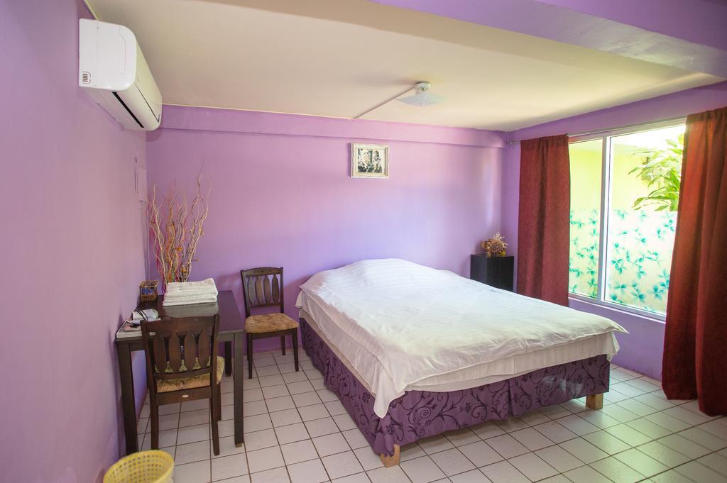 G.T. Guest House Garapan Quarto foto